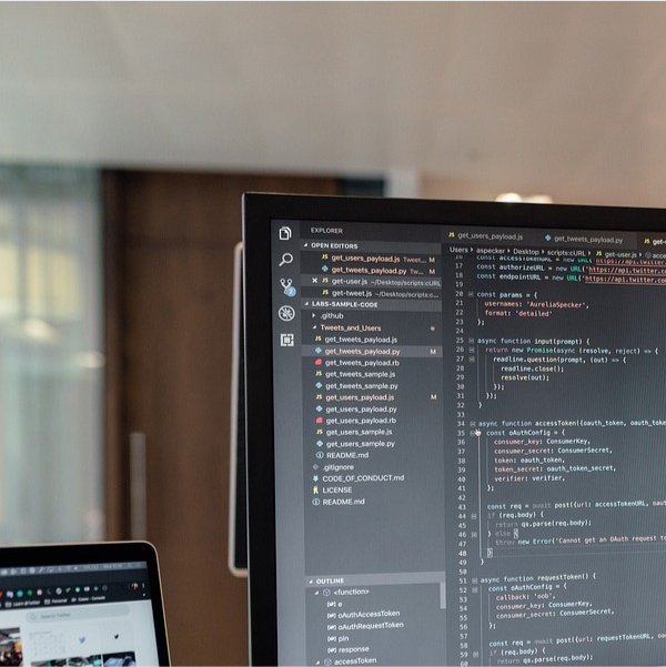 Code shown on a computer screen in an office